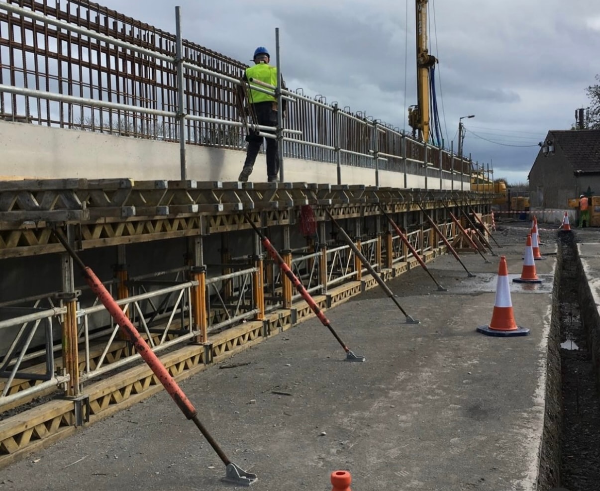 Construction worker on elevated scaffolding