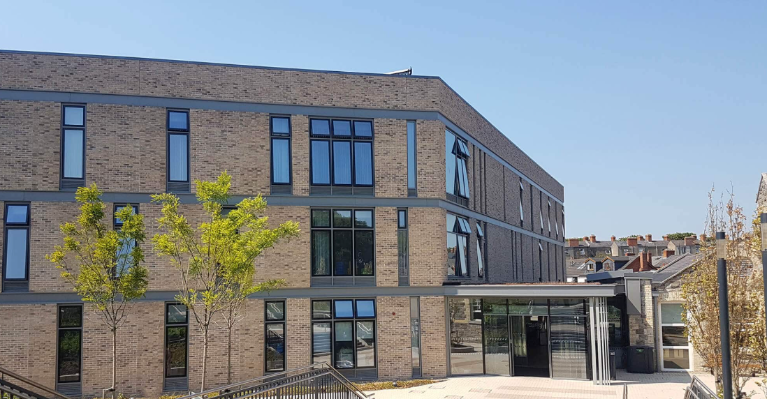 Modern brick building with large windows and contemporary architecture