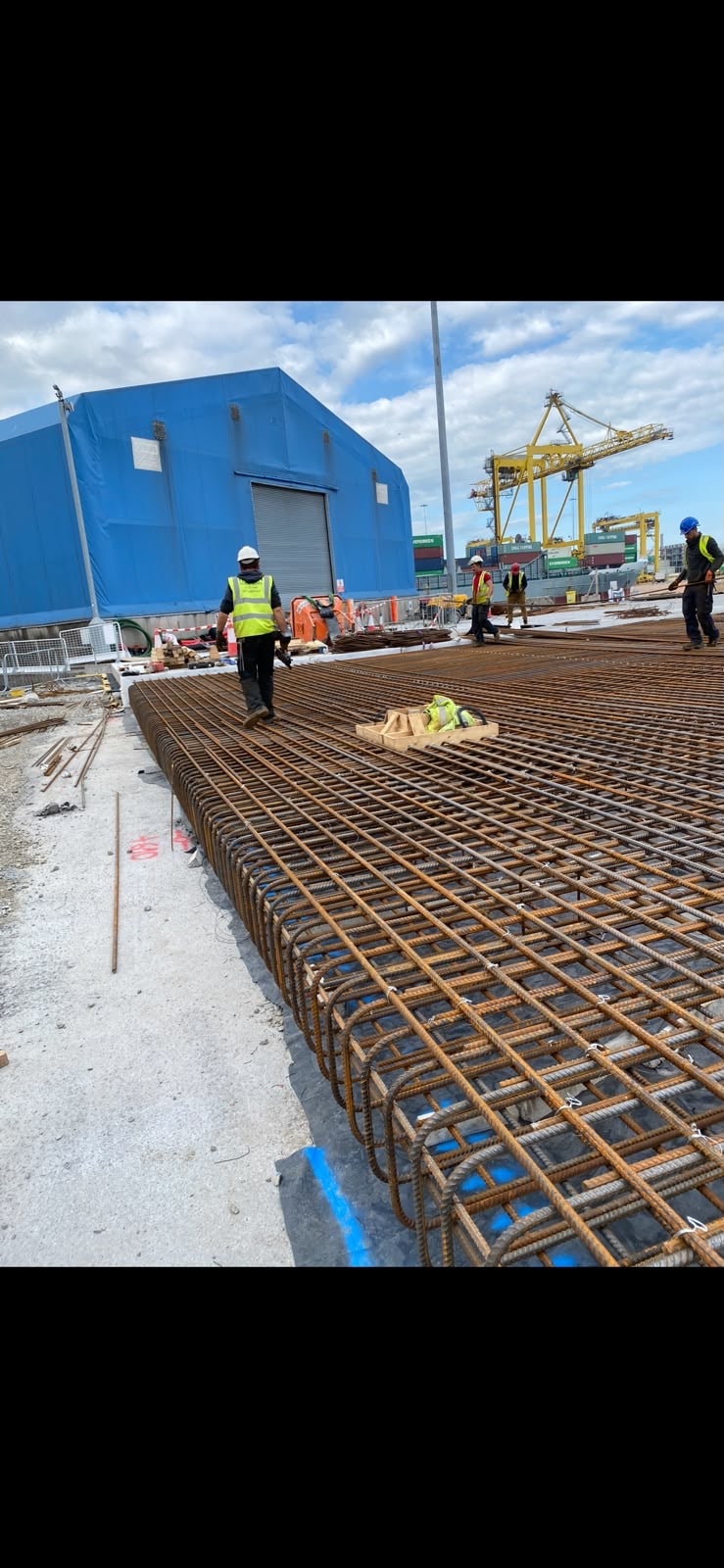 Workers laying steel reinforcement at Dublin Port construction site