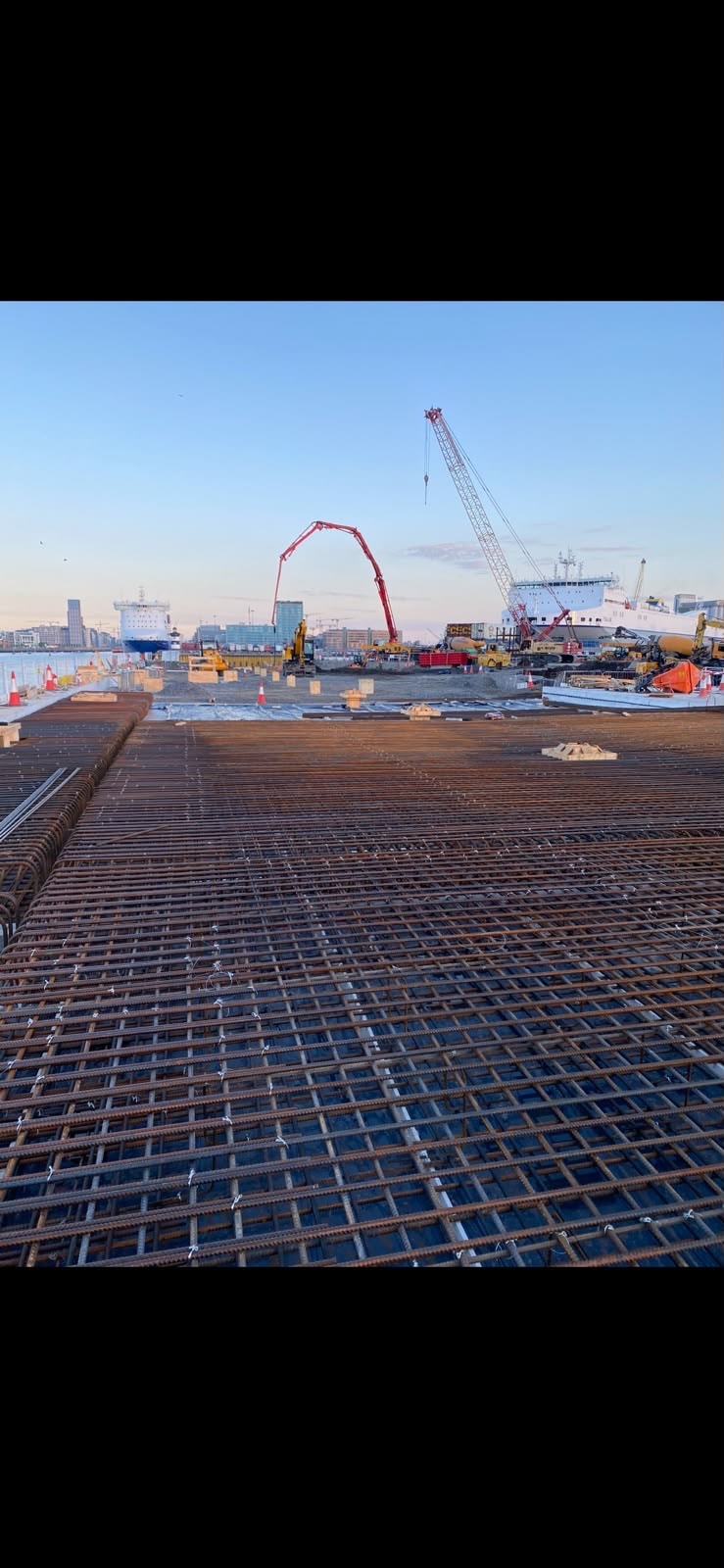 Steel reinforcement grid laid at Dublin Port with Poolbeg chimneys in background