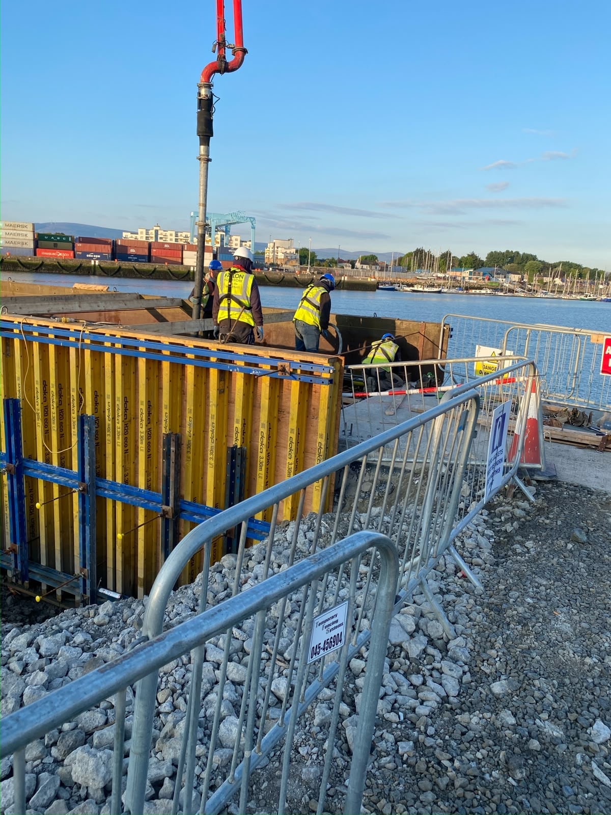 Fallon Formwork crew working with yellow formwork panels at Dublin Port