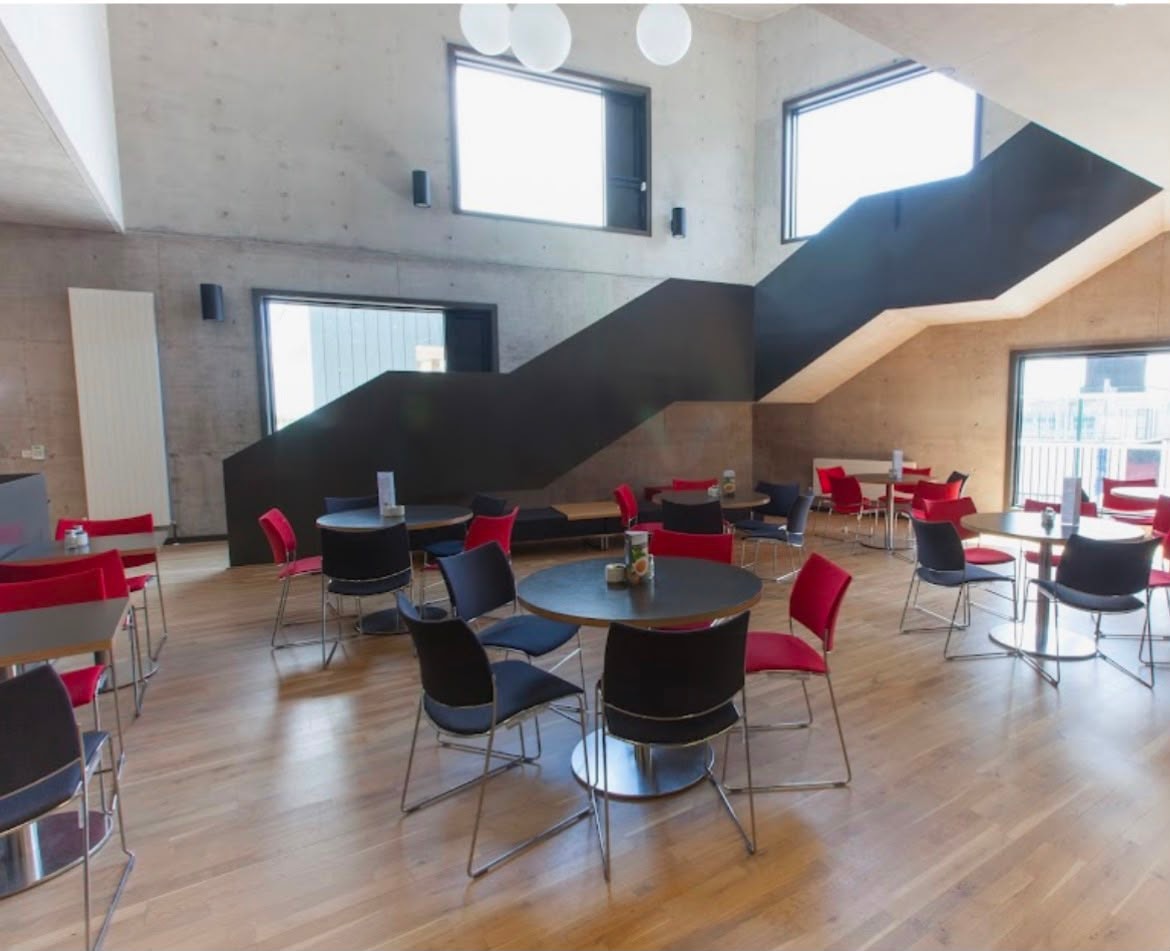Modern concrete interior cafeteria with staircase