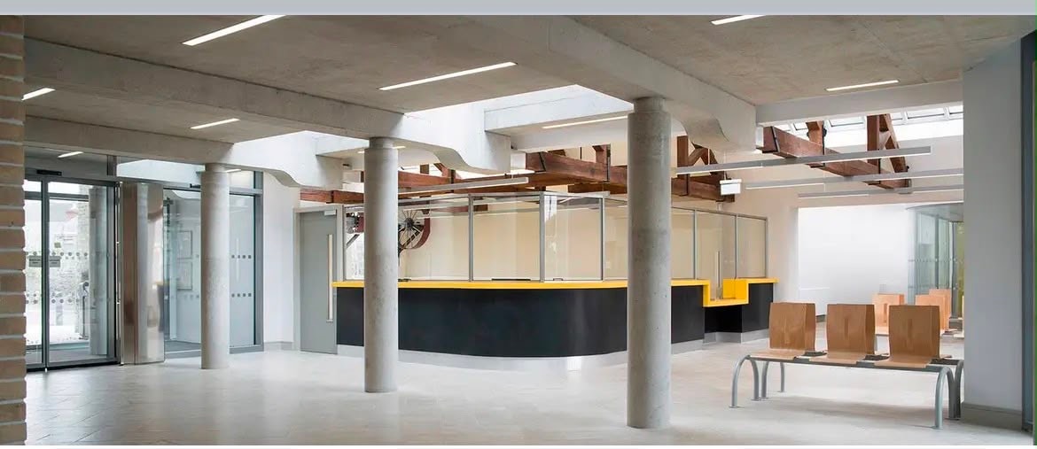 Concrete interior with columns and reception area