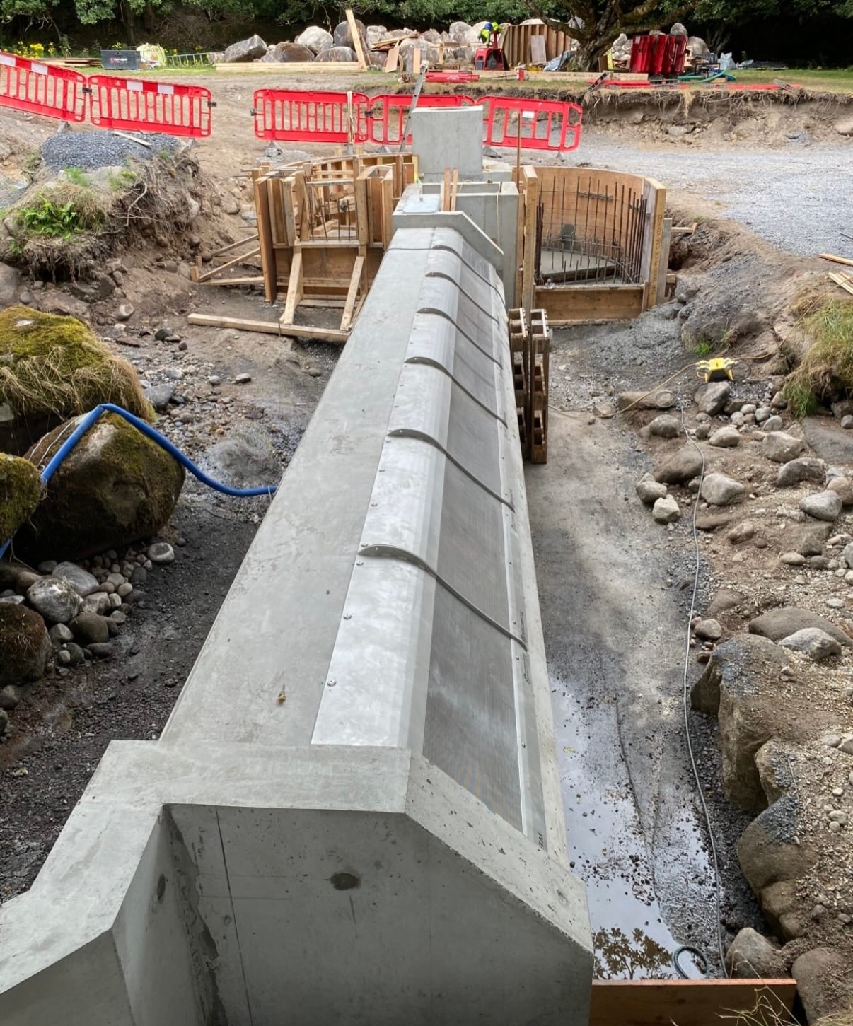 Concrete weir beam freshly cast, formwork still in place