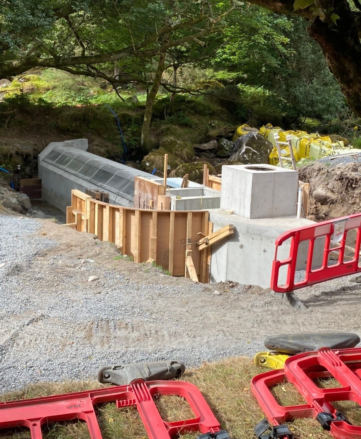 Early stage formwork and concrete structure in woodland setting